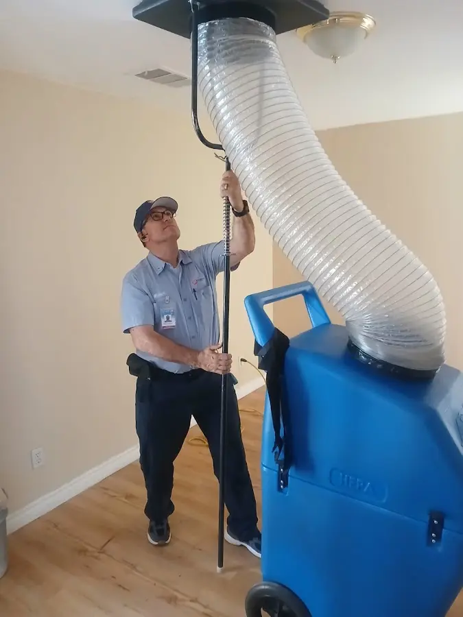 Furnace Tune-Up technician using HEPA equipment in Decatur